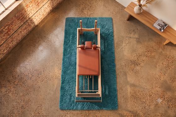 Jack Knife reformer on the teal Stage rug